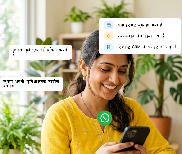 A woman in a yellow kurta smiling while using WhatsApp on her phone